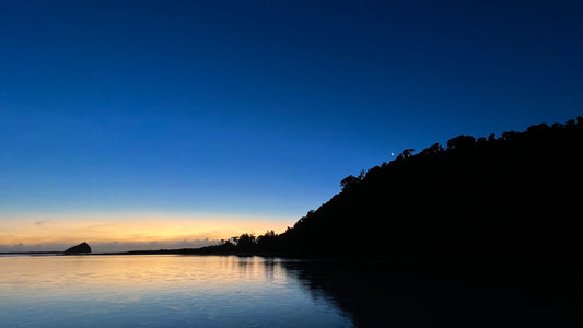 Blue skies above water